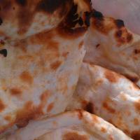 3. Naan · (Light and fluffy authentic Indian bread baked in a clay oven)