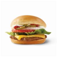 Cheeseburger Deluxe · Fresh, never frozen beef topped with cheese, pickles, onions, tomatoes, crisp lettuce, ketch...