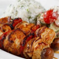 Grilled Chicken Kebabs · Marinated  grilled chicken served over cilantro rice with cucumber & feta salad