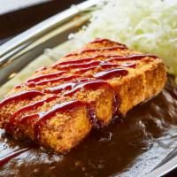 Tofu Katsu Curry · Breaded fried tofu cutlet, drizzled with tonkatsu sauce, served with shredded cabbage and Ja...