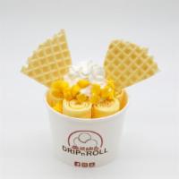Mango Passion · Mango ice cream, topped with whipped cream, waffle pieces, mango cubes, and mango drizzle