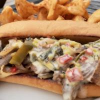 Texas Cheese Steak Sandwich · Grilled Peppers, Grilled Onions with Thinly sliced Skirt Steak with Poblano Queso served on ...