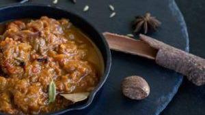Lamb Curry · Spicy. Lamb cooked in mild onion, tomato sauces with spice's special masala.