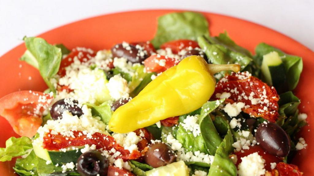 Greek Salad · With feta, sundried tomatoes and kalamata olives.
