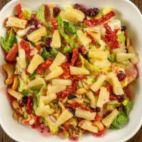 Nutty Hawaiian Salad · Comes with walnut raspberry dressing. With cashews, pineapple, sun-dried tomatoes, and cranb...