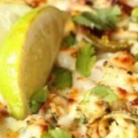 Scorcher · Spicy red sauce, roasted chicken, jalapeño, roasted corn, onions, Mozzarella cheese, and a h...