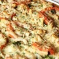 Molly'S · Red sauce, roasted chicken, baby spinach, roma tomatoes, oregano, sesame seeds, extra virgin...
