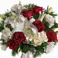 A Christmas Kiss By Teleflora · The picture of holiday romance. Wonderful white hydrangea and rich red roses fill our stunni...