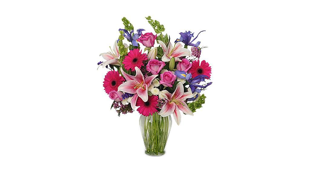 Remembering You · This lovely arrangement features Blue iris, pink gerberas, stargazer lilies, roses, bells of Ireland, button poms, and fillers. It's a classic arrangement, sure to please and make her smile.