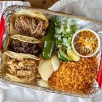 Tres Taco Platter · 3 tacos, rice and  choice beans, lime, grilled onion, grilled jalapeno, fresh chopped onion ...