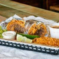 Burrito · warm flour tortilla filled with meat, rice, beans and cheese. Served with rice, beans, grill...