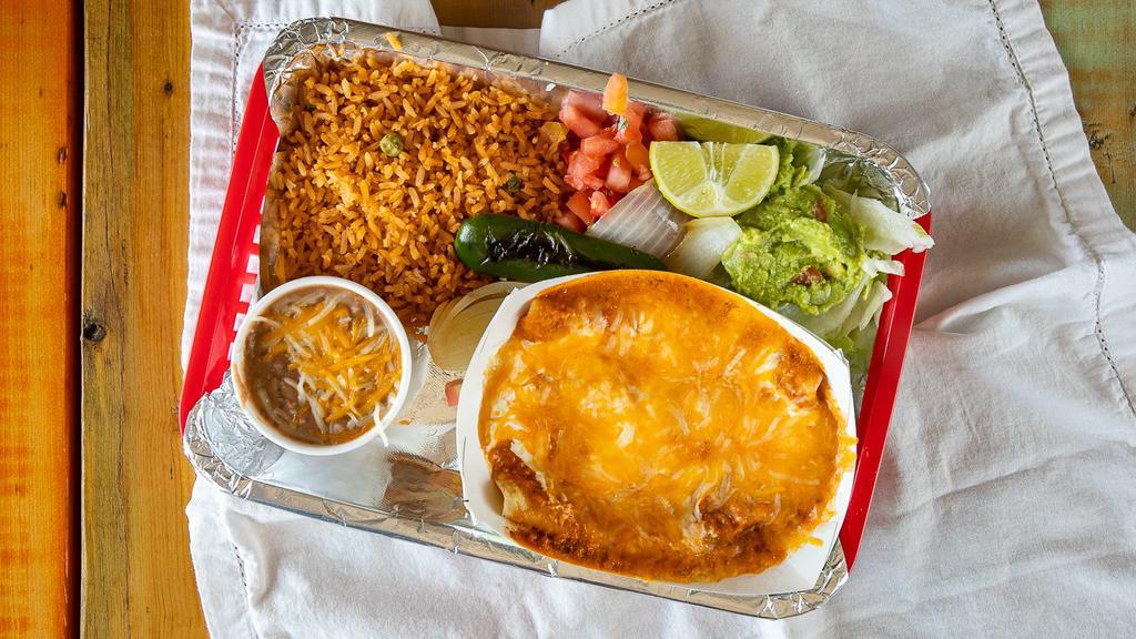Enchilada · 3 meat or cheese enchiladas rolled in corn tortilla covered in Tacolicious sauce, sour cream and cheese.  Served with rice, beans, grilled onion, grilled jalapeño, lime, lettuce, pico, and guac