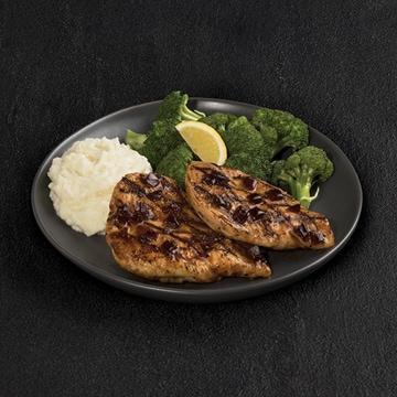 Fridays Signature Whiskey-Glazed Chicken · Signature Whiskey-Glaze over two grilled chicken breasts Served with mashed potatoes and lemon-butter broccoli