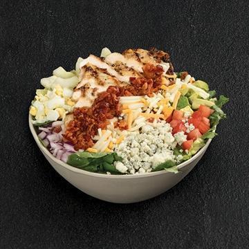 Million Dollar Cobb · Grilled chicken, mixed greens, sliced carrots, red cabbage, avocado, tomatoes, chopped cage-free egg, bacon, blue cheese, red onions, cucumber, Monterey Jack and cheddar Ranch dressing on the side