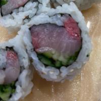 Yellow Tail Roll · Yellow tail,  green onion, and cucumber inside.