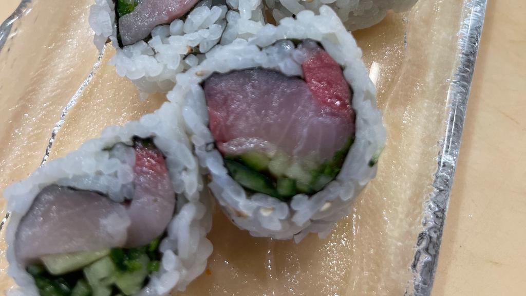 Yellow Tail Roll · Yellow tail,  green onion, and cucumber inside.