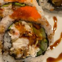 Spider Roll · Soft shell crab, crab meat, avocado, cucumber, mountain carrot, and radish sprout inside top...