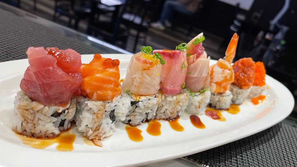 Akari · California roll topped with ahi tuna, salmon, Japanese Sea Bream, albacore, shrimp, yellowtail, spicy tuna,smelt egg, served with yuzu and eel sauce.