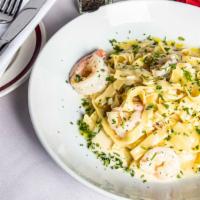Gamberetti Alfredo · Sauteed shrimp with a creamy alfredo sauce over fettuccine pasta.