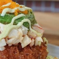 Sushi Donut · sticky rice stuffed with cream cheese, deep fried and topped with avocado, crab salad, masag...