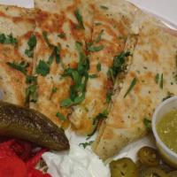 Chicken Quesadilla · With caramelized onions, sour cream, and jalapenos