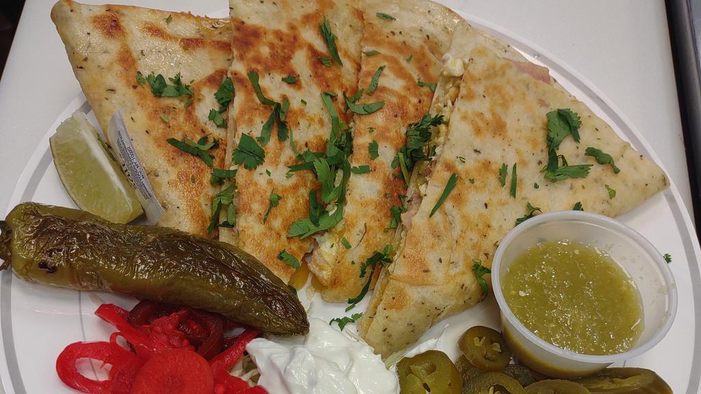 Chicken Quesadilla · With caramelized onions, sour cream, and jalapenos
