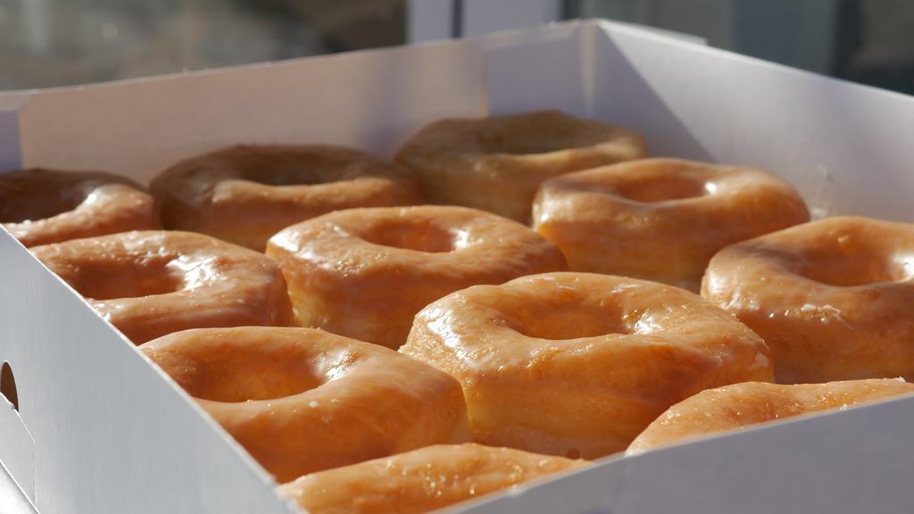 Dozen Original Glazed · One dozen of original glazed donuts.