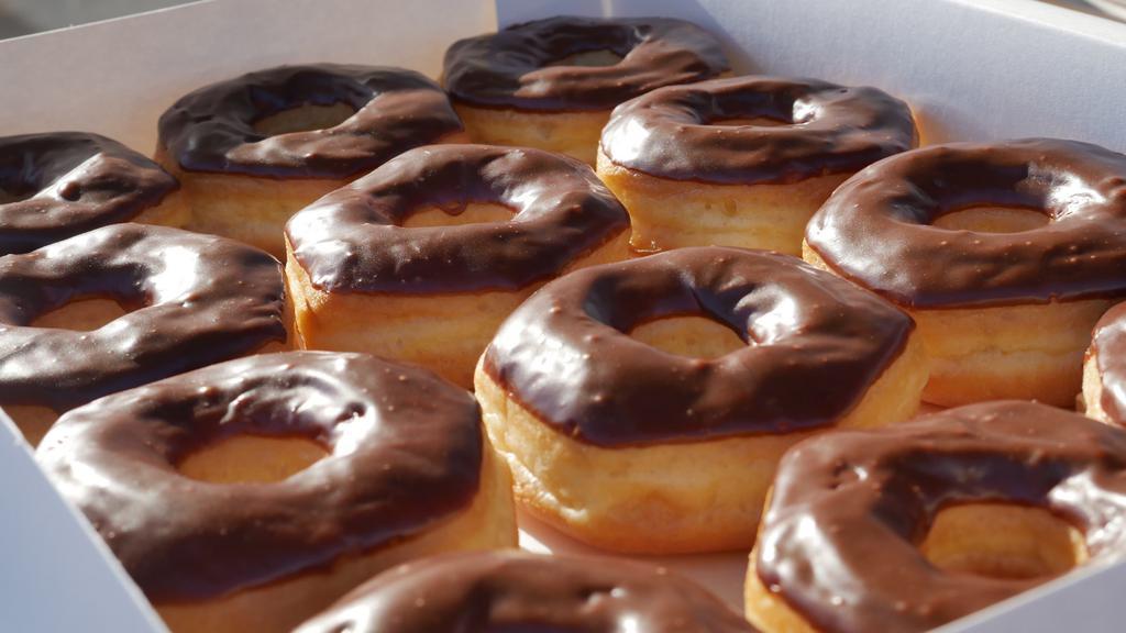 Dozen Chocolate Glazed · One dozen of chocolate glazed donuts.