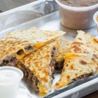 Quesadilla · Quesadilla With Your Choice Of Meat. Including 1 Side Of Sour Cream And Guacamole