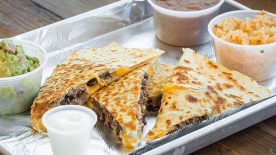 Quesadilla · Quesadilla With Your Choice Of Meat. Including 1 Side Of Sour Cream And Guacamole
