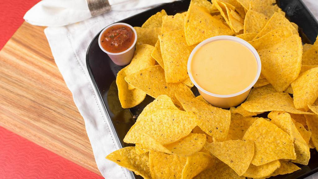 Chips & Queso (4 Oz) · 