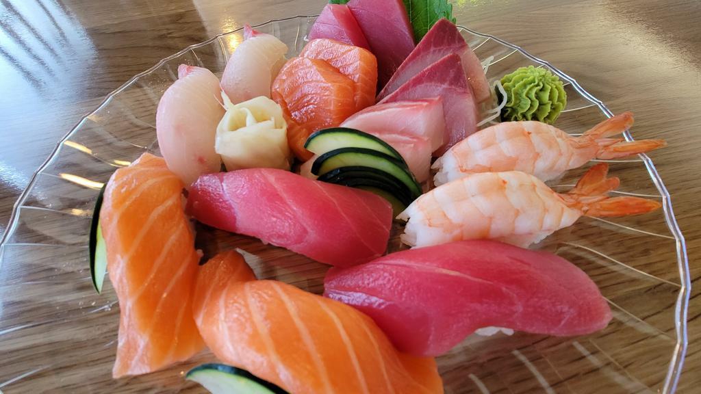 Sushi (8Pc) + Sashimi (8Pc) Combo · Sushi: Tuna (2), Salmon (2),Red Snapper (2), Shrimp (2) Sashimi: Tuna (2), Salmon (2),
Red Snapper (2), Yellowtail (2)