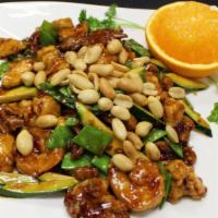 Kung Pao Triple Delight · Spicy. Shrimp, chicken and beef prepared in a traditional spicy kung pao sauce with chili pe...