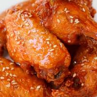 Korean Fried Chicken Wings · Doused in our sweet and spicy gangnam sauce and garnished with sesame seeds. complimentary s...