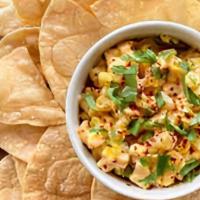 Korean Esquites And Chips · Grilled corn, korean pepper, cilantro, lime, and magic sauce served with crispy corn tortill...