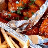 100 Count Wing Pack · 100 Korean Fried Chicken Wings doused in your choice of wing sauce and garnished with sesame...