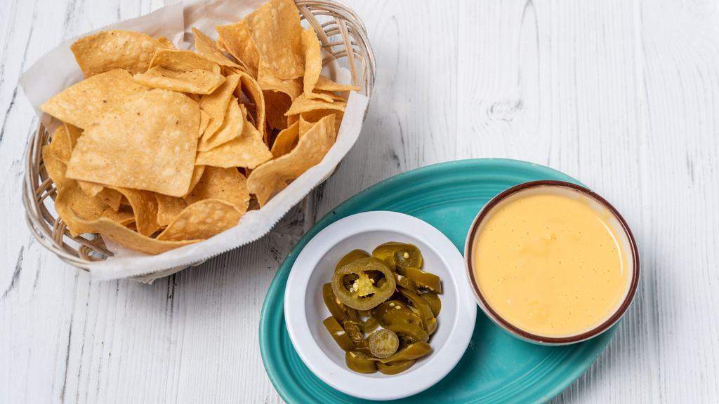 Chile Con Queso · With a side of jalepeños.