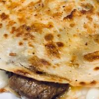 Quesadillas · A fresh flour tortilla, filled with Asadero and Colby Jack cheeses, grilled to a nice crust....