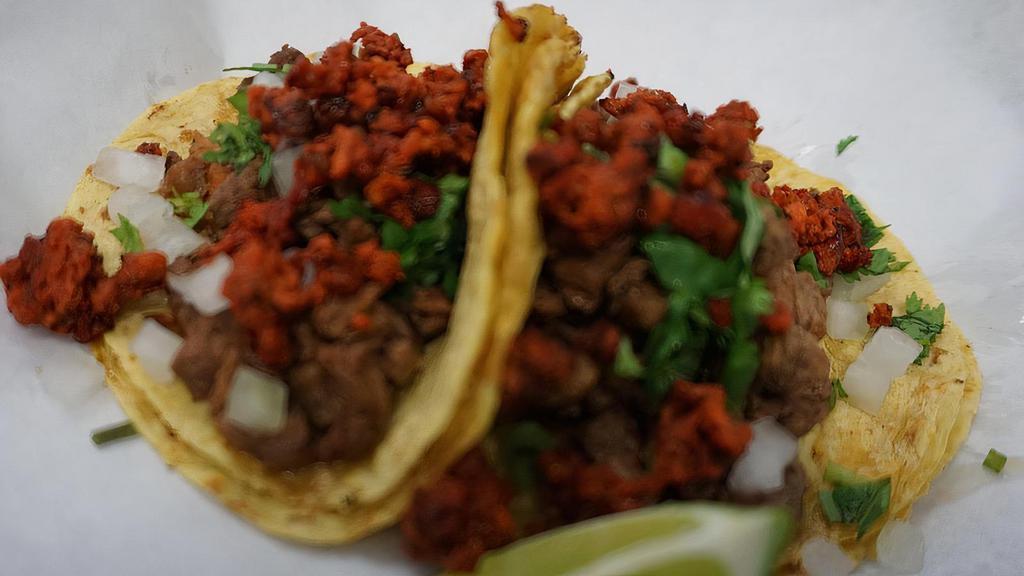 Campechanos Tacos · The meat of your choice, cilantro and onions (unless you tell us to hold’em), topped with homemade chorizo.