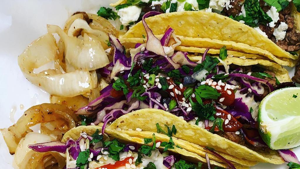 Korean Bbq Tacos · Pick your protein, glazed with a delicious “bulgogi” Korean BBQ Sauce, freshly shaved slaw, with an Asian vinaigrette, sesame seeds and Rooster Sauce.
