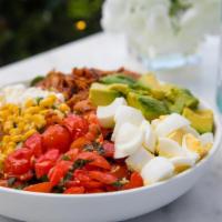 Cobb Salad · spring mix, hard boiled eggs, basil infused cherry tomatoes, avocado, bacon, feta, corn sala...