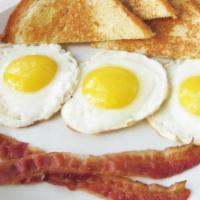 French Breakfast · 3 eggs any style, bacon strips, & brioche