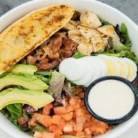 Cobb Salad · Sliced grilled chicken on a bed of mixed greens with diced smoked bacon, diced tomato, avoca...