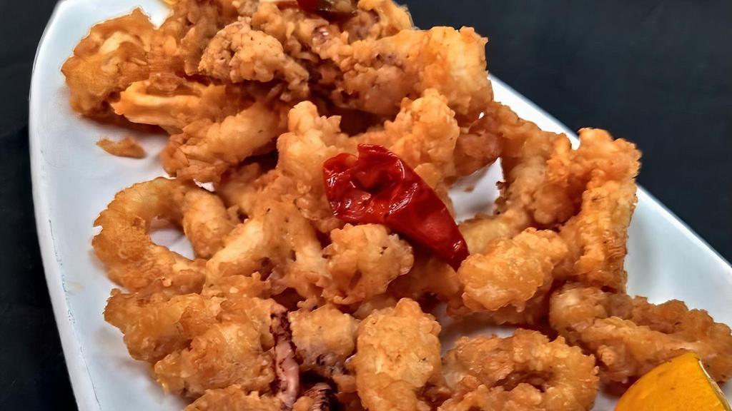 Calamari With Peppers · Fresh calamari breaded and fried till golden brown with calabrian chilis, served with cocktail and sweet chili sauce for dipping.