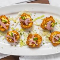 Crispy Deviled Eggs · Lightly fried, topped with candied bacon, pickled red onions, and a fresh jalapeno slice