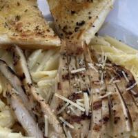 Grilled Chicken Pasta Carbonara · A heaping bowl of penne pasta tossed in a creamy smoked gouda cheese and bacon sauce, topped...