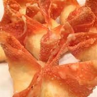 Crab Rangoon · Deep fried wonton stuffed with crabmeat, cream cheese, onions, carrots and served with sweet...