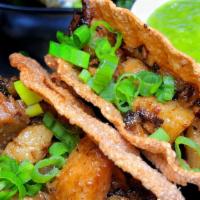 Shókku Tacos · (2 pieces) Dumpling Skin Taco Shells w/ Pork, Green Onion, Oni Hot Sauce
