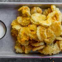Fried Pickles · Lightly breaded dill pickle slices fried to perfection and served with a side of ranch.