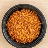 Jollof Rice Family Meal · Comes with half tray of rice and six pieces of chicken.